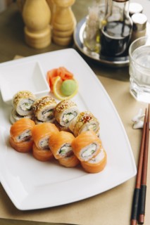 Sushi on plate with chopsticks