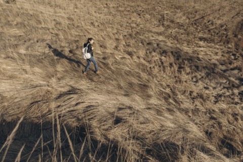 Middle Eastern woman walking on hill