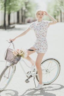 Middle Eastern woman sitting on bicycle