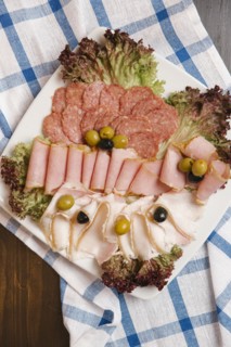 Variety of sliced meat on plate