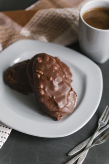 Chocolate cookies with nuts on plate