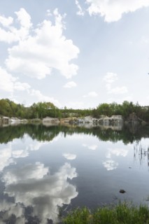 Reflection of clouds in still lake