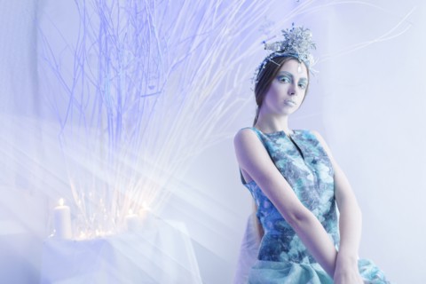 Ethereal woman wearing blue dress and makeup