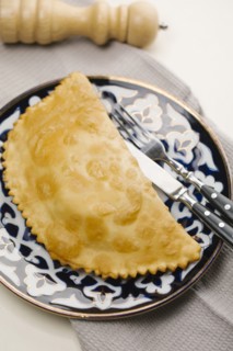 Pastry on plate with fork and knife