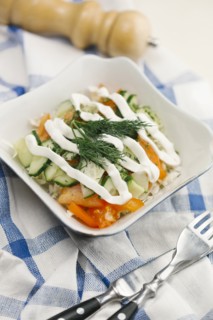 Garnish and dressing on salad in bowl