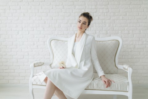 Portrait of glamorous Middle Eastern woman sitting on bench