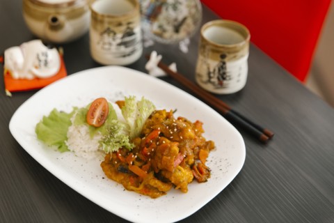 Chopsticks near plate of food