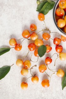 Cherries on white wooden table