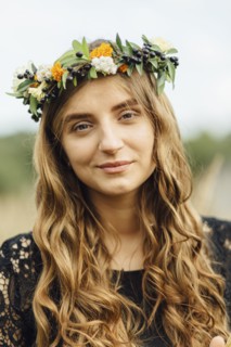 Middle Eastern woman wearing flower crown outdoors