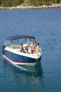 Friends relaxing on boat in ocean