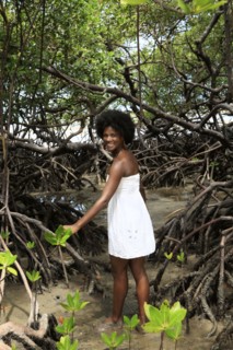 Black woman smiling in mangrove jungle