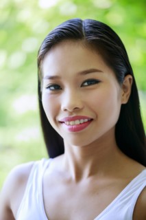 Portrait of smiling Asian teenage girl