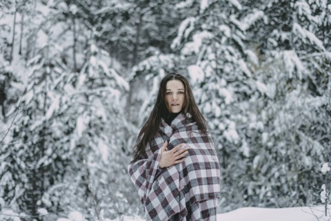 Portrait of Caucasian woman in snowy forest