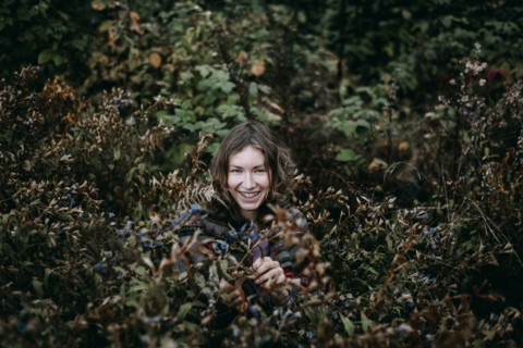 Caucasian woman smiling in bush