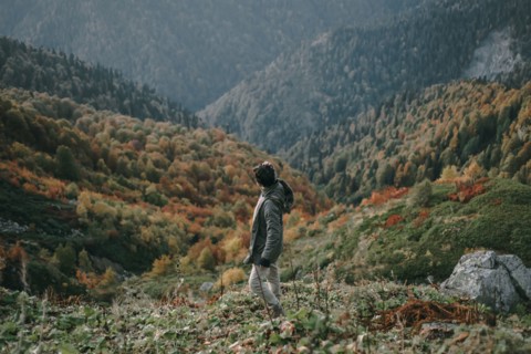 Caucasian man walking in valley