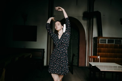 Caucasian woman dancing in livingroom