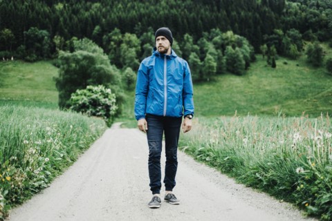 Caucasian man standing on dirt path