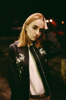 Caucasian woman wearing floral jacket