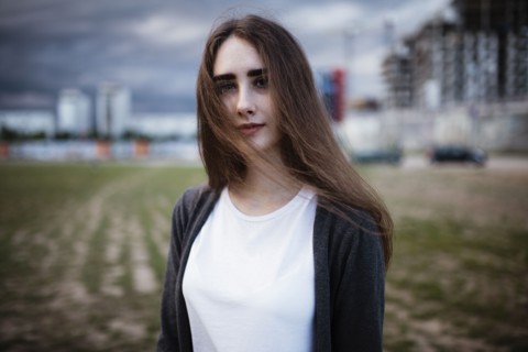 Wind blowing hair of Caucasian woman