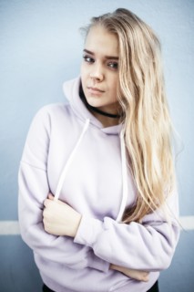 Portrait of serious Caucasian woman wearing hoodie
