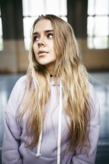 Portrait of pensive Caucasian woman in gymnasium