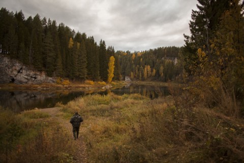Caucasian man walking in rural landscape