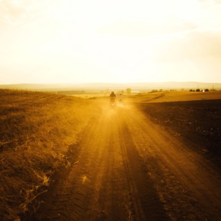 Dirt bikers driving on rural road