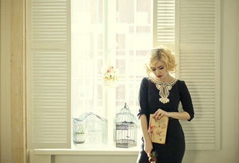Caucasian woman holding book by window