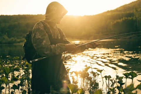 Mari man fishing in lake