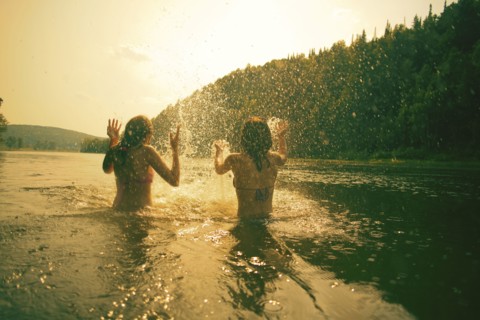 Children splashing in lake