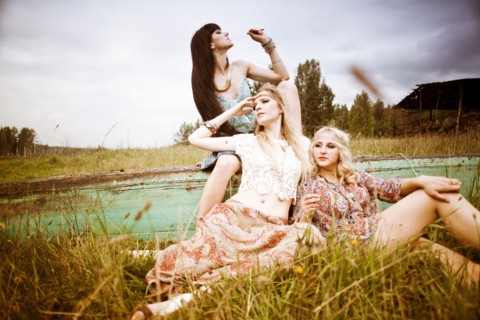 Caucasian women relaxing in field