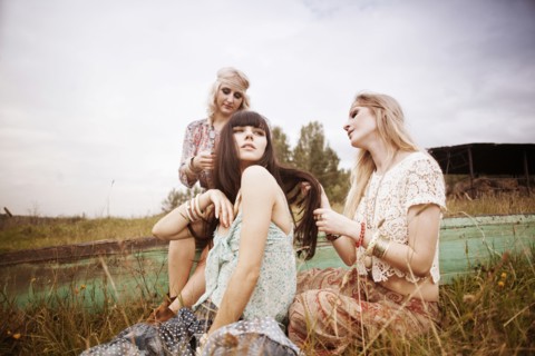 Caucasian women relaxing in field