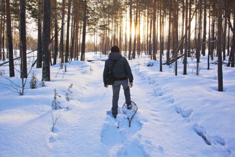 Mari man snowshoeing on snowy path