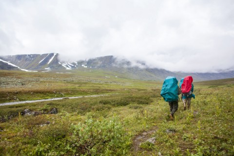 Backpackers walking on rural path