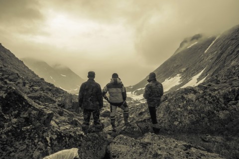 Hikers admiring mountain valley
