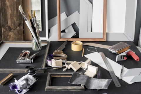 Picture frame and tools on tables