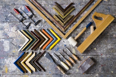 Picture frame tools on splattered table