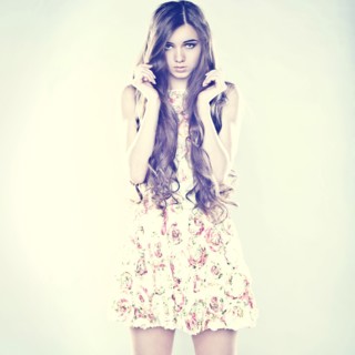 Portrait of Caucasian teenage girl holding hair
