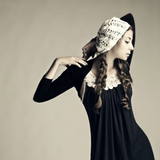 Caucasian girl wearing traditional dress and hat