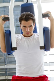 Hispanic man working out in health club