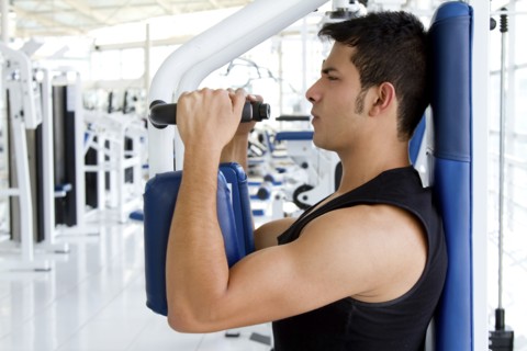 Hispanic man working out in health club
