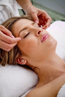 Hispanic woman having facial