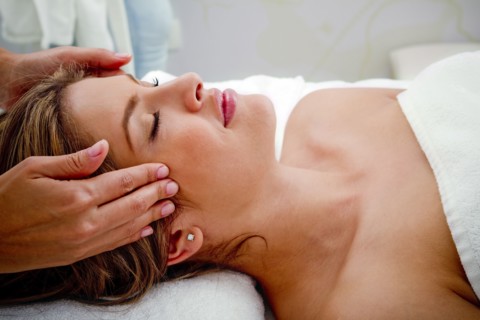Hispanic woman having facial
