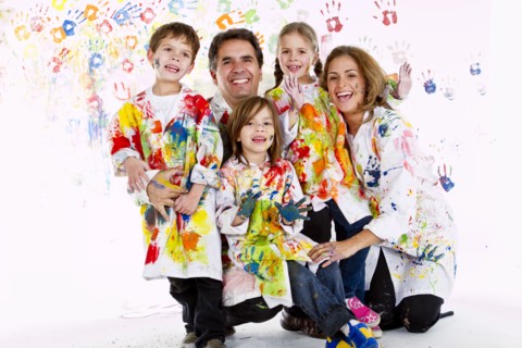 Hispanic family covered in paint