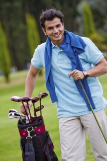 Hispanic man playing golf