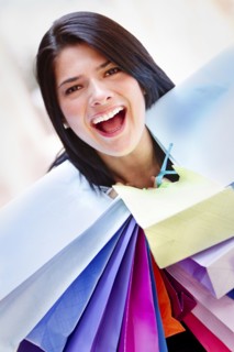 Hispanic woman carrying shopping bags