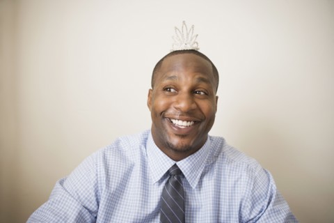 African man wearing tiara