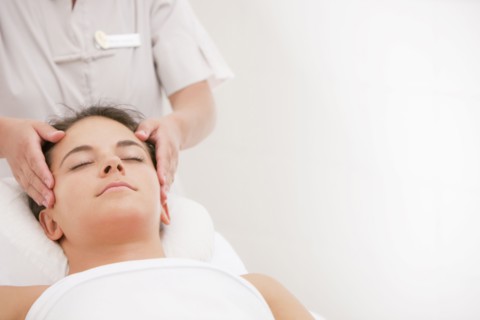 Woman having facial massage