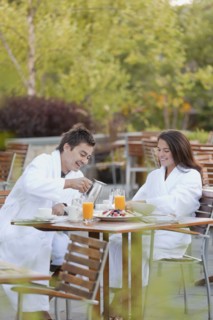 Couple enjoying breakfast on outdoor patio