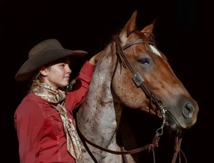Portrait of Caucasian girl posing with horse
